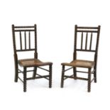 A pair of oak bobbin chairs