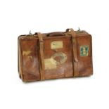 A vintage brown leather travel bag