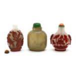 A group of three Chinese Peking glass snuff bottles,
