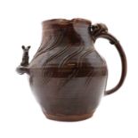 A stoneware glazed jug