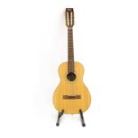 A Vintage 12 string Paul Brett Signature acoustic guitar,