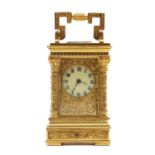 A miniature gilt metal carriage clock,