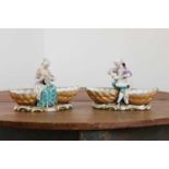 A pair of Meissen porcelain figural double salts,