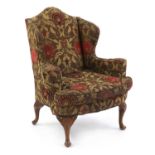 A Queen Anne style walnut wing armchair