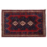 A Persian wool rug,