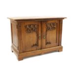 A Continental Art Nouveau oak cupboard,