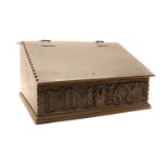 A carved oak Bible box