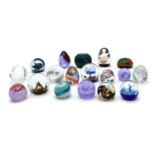 A collection of boxed Caithness glass paperweights,