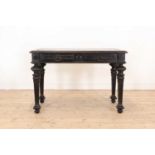 An ebonised writing table,