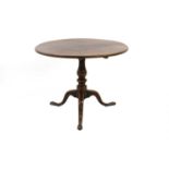 A mahogany tripod table,