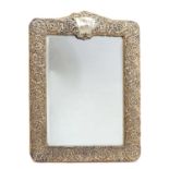 A large silver mounted mirror