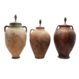 A group of three earthenware amphoras,