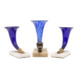 A group of three blue glass cornucopias