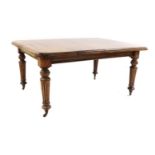 A Victorian extending mahogany dining table