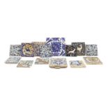 A collection of pottery tiles,