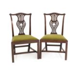 A pair of George III mahogany dining chairs