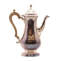 A large silver coffee pot