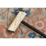 A marine ivory and calamander walking stick,