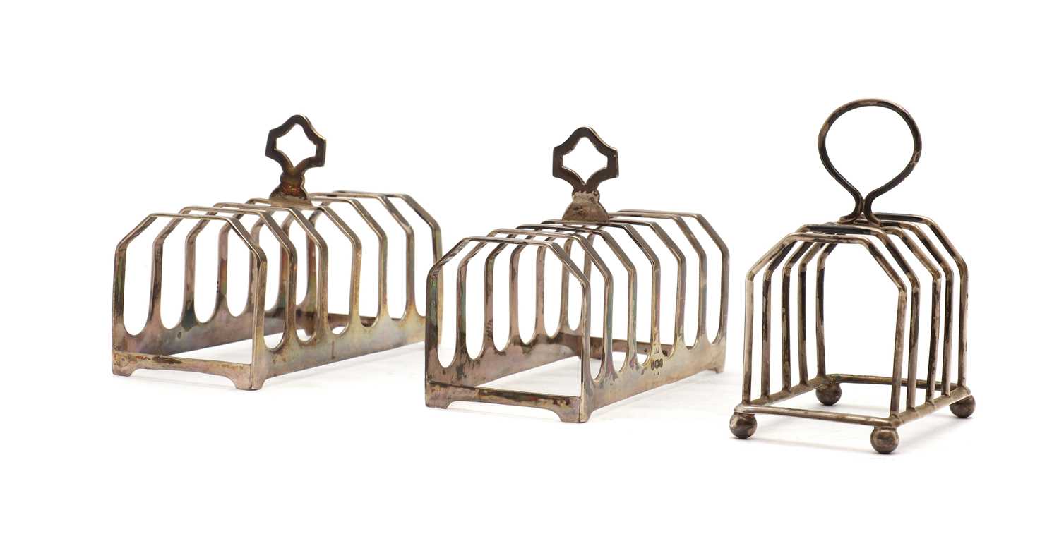 A pair of six division silver toast racks