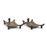 A pair of bronze card trays,