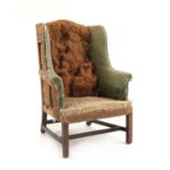 A George III wing armchair