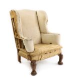 A walnut wing armchair