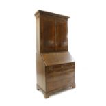 A George I style walnut bureau bookcase,