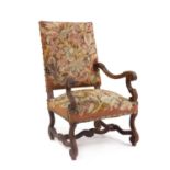 A carved walnut armchair,