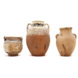 A group of three earthenware jars