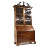 A mahogany bureau bookcase