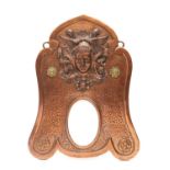 An Art Nouveau copper mirror,