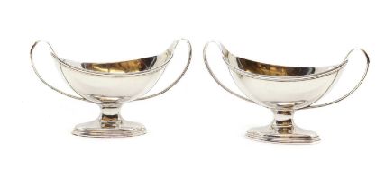 A pair of George III silver twin handled salts