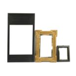 An ebonised pine mirror,