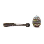 A Russian style silver gilt and enamel egg,