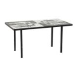 A wrought iron coffee table,