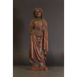 An ecclesiastical carved oak figurine,