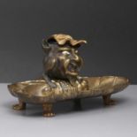 A bronze inkwell,