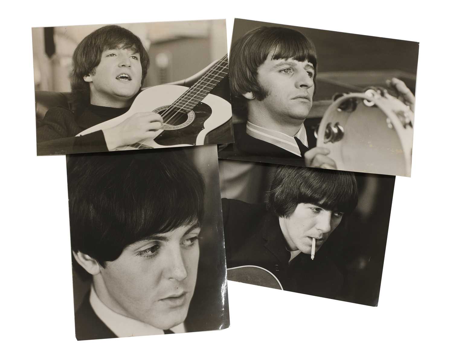 A set of four portrait photographs of the Beatles,