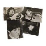 A set of four portrait photographs of the Beatles,