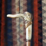 A carved malacca cane,