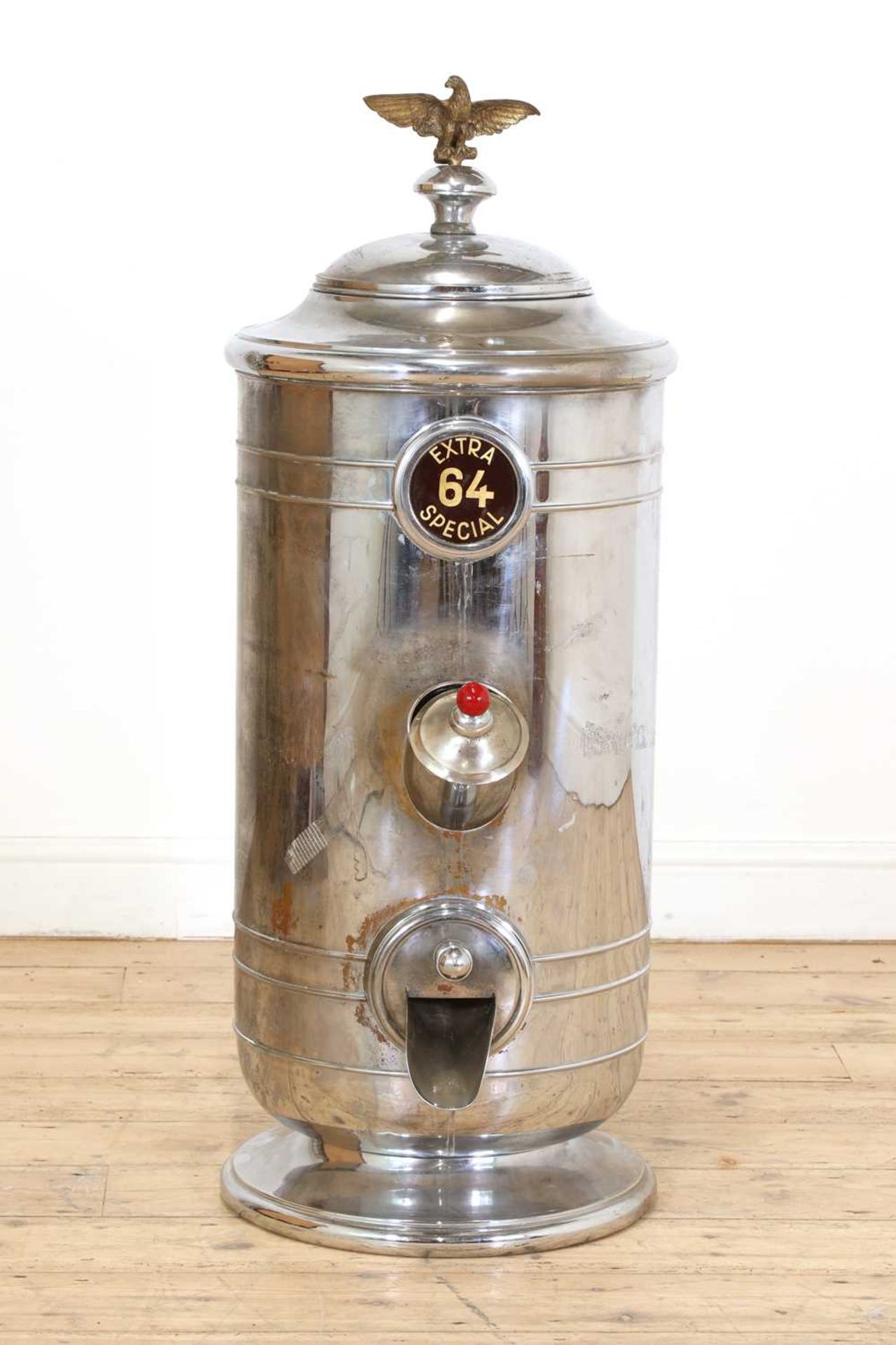 A nickel-plated cafe coffee bean dispenser,