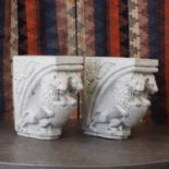 A pair of glazed stoneware corbels,