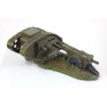 A 'Starkie's' cast metal World War 1 mark 3 tank and field gun money box,