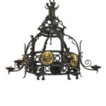 A wrought iron six-branch Arts & Crafts-style electrolier,