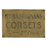 An acid-etched brass advertising sign,