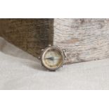 Early cycling interest: an unusual silver watch-fob-suspended compass,