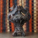 A wrought iron ornamental urn,
