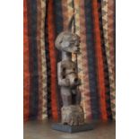 Songye society: a carved Songye power figure,