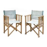 A pair of folding teak director's chairs,