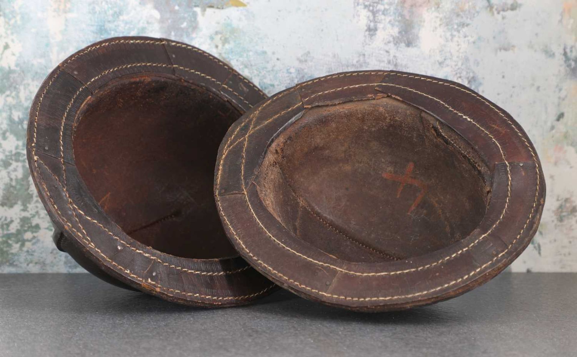 A pair of patinated leather miner's helmets, - Image 5 of 5